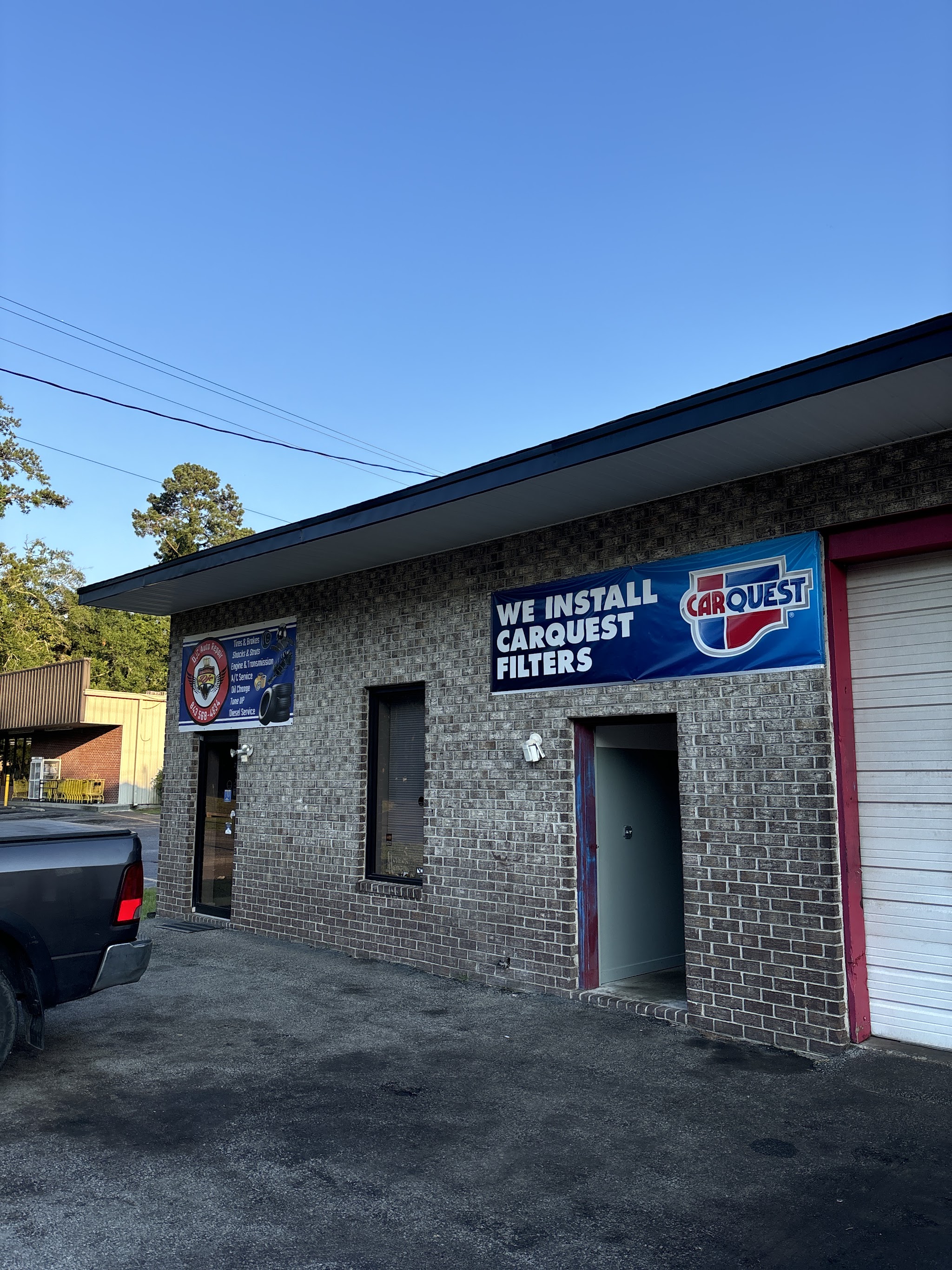 Our shopfront on Central Ave with the DJC Auto Repair banner by the door